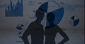 Silhouette of male and female athlete against statistical data processing on blue background