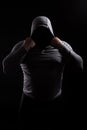 Silhouette of a male fight club in a hood without a face. Stalker silhouette on black background, incognito, anonymous, dangerous Royalty Free Stock Photo