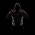 Silhouette of a male fight club in a hood without a face. Stalker silhouette on black background, incognito, anonymous, dangerous Royalty Free Stock Photo