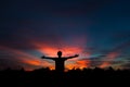 Silhouette of a male holding hands at sunrise Royalty Free Stock Photo