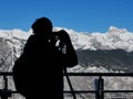 Silhouette of male landscape photographer capturing breathtaking