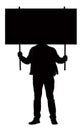 Silhouette of a Male Protester Holding Protest Banner in Front His Face