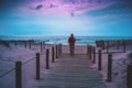 Silhouette of man on the beach looking at sunset Royalty Free Stock Photo