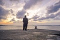 Silhouette of man on the beach at sunset