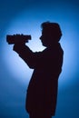 Silhouette of man with binoculars