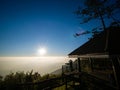 Silhouette Man Blocked His Hands and Gazed at The Sunrise on The Pavilion Royalty Free Stock Photo