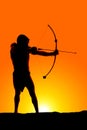 Silhouette man with bow and arrow