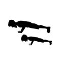 Silhouette of man and boy father and son doing push ups workout