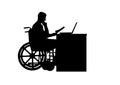 Silhouette of a man a businessman disabled in a wheelchair sitting at a table