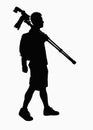 Silhouette of man carrying camera and tripod. Royalty Free Stock Photo