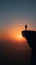 Silhouette man cliff sunset horizon sunrise solitude Royalty Free Stock Photo