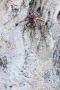 Silhouette of man climbing on rock, mountain at sunset. Royalty Free Stock Photo