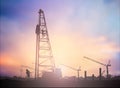 Silhouette man construction worker in a building site over Blurred construction worker on construction site Royalty Free Stock Photo