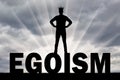Silhouette of a man with a crown on his head is on the word ego Royalty Free Stock Photo