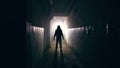 Silhouette of man in dark creepy and spooky corridor Royalty Free Stock Photo