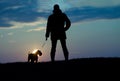 Silhouette of man and dog Royalty Free Stock Photo