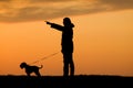 Silhouette of man and dog Royalty Free Stock Photo