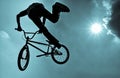 Silhouette of a man doing an BMX extreme jump. Royalty Free Stock Photo