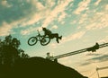 Silhouette of a man doing a jump with a bmx bike Royalty Free Stock Photo