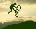 Silhouette of a man doing a jump with a bmx bike Royalty Free Stock Photo