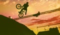 Silhouette of a man doing a jump with a bmx bike Royalty Free Stock Photo