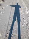 Silhouette of a man doing stop sign while standing on an earth road Royalty Free Stock Photo