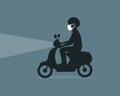 Silhouette of a man driving scooter wearing air pollution protective face mask