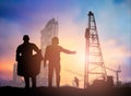 Silhouette man engineer looking construction worker in a building site over Blurred construction worker on construction site Royalty Free Stock Photo