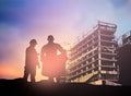 Silhouette man engineer looking construction worker in a building site over Blurred construction worker on construction site Royalty Free Stock Photo