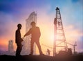 Silhouette man engineer looking construction worker in a building site over Blurred construction worker on construction site Royalty Free Stock Photo