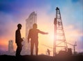 Silhouette man engineer looking construction worker in a building site over Blurred construction worker on construction site Royalty Free Stock Photo