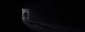 Silhouette of man entering dark room with bright light in doorway 3d render Royalty Free Stock Photo