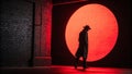 Mysterious Man in Red-Lit Alleyway Stock Photo Royalty Free Stock Photo