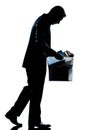 Silhouette man fired carrying heavy box Royalty Free Stock Photo