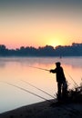 Silhouette of man fishing in a sunset Royalty Free Stock Photo