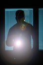Silhouette of a man with flashlight Royalty Free Stock Photo