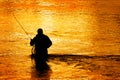 Silhouette of Man Flyfishing in River Royalty Free Stock Photo