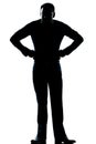 Silhouette man full length angry hands on hips