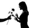 Silhouette man hand offering a flower rose Royalty Free Stock Photo