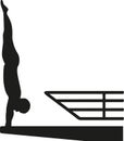 Silhouette of man at a high diving platform