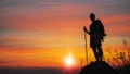 Silhouette of man hiker standing on rocky mountain peak with sunset golden sky feeling of freedom Royalty Free Stock Photo