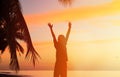 Silhouette of man with his hands up at sunset Royalty Free Stock Photo