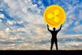 Silhouette of a man holding a ripple coin against the sky Royalty Free Stock Photo