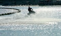 Silhouette of a man on the jet ski in the sea with water splashes at Koh Larn island,Pattaya, Chonburi, Thailand. Royalty Free Stock Photo