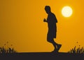 Silhouette of man jogging during sunrise