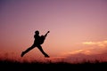 Silhouette man jumping with guitar Royalty Free Stock Photo