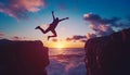 Silhouette man jumping over cliffs for I can do it , good mindset by never give up concept Royalty Free Stock Photo