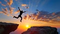 Silhouette man jumping over cliffs for I can do it , good mindset by never give up concept Royalty Free Stock Photo