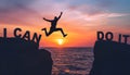 Silhouette man jumping over cliffs for I can do it , good mindset by never give up concept Royalty Free Stock Photo