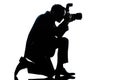 Silhouette man kneeling photographer